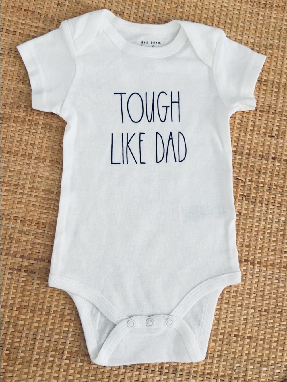 Rae Dunn White Baby One-Piece Bodysuit with Navy Text- Tough Like Dad" Size 6-9